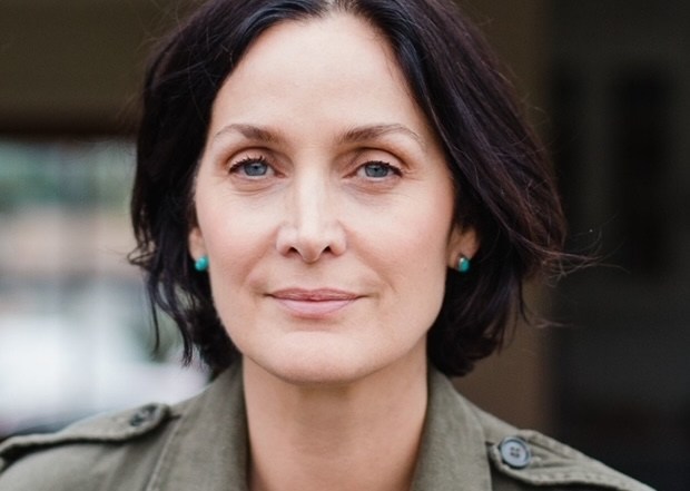 Carrie-Anne Moss posing for event