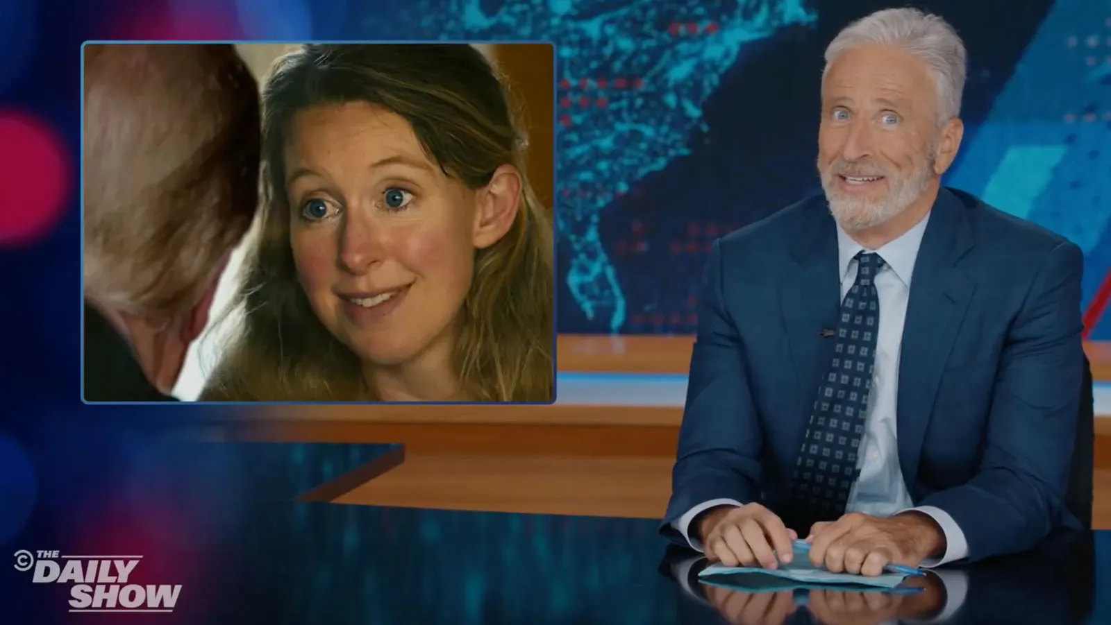 Jon Stewart Compares Trump Aide to Elizabeth Holmes news cover image