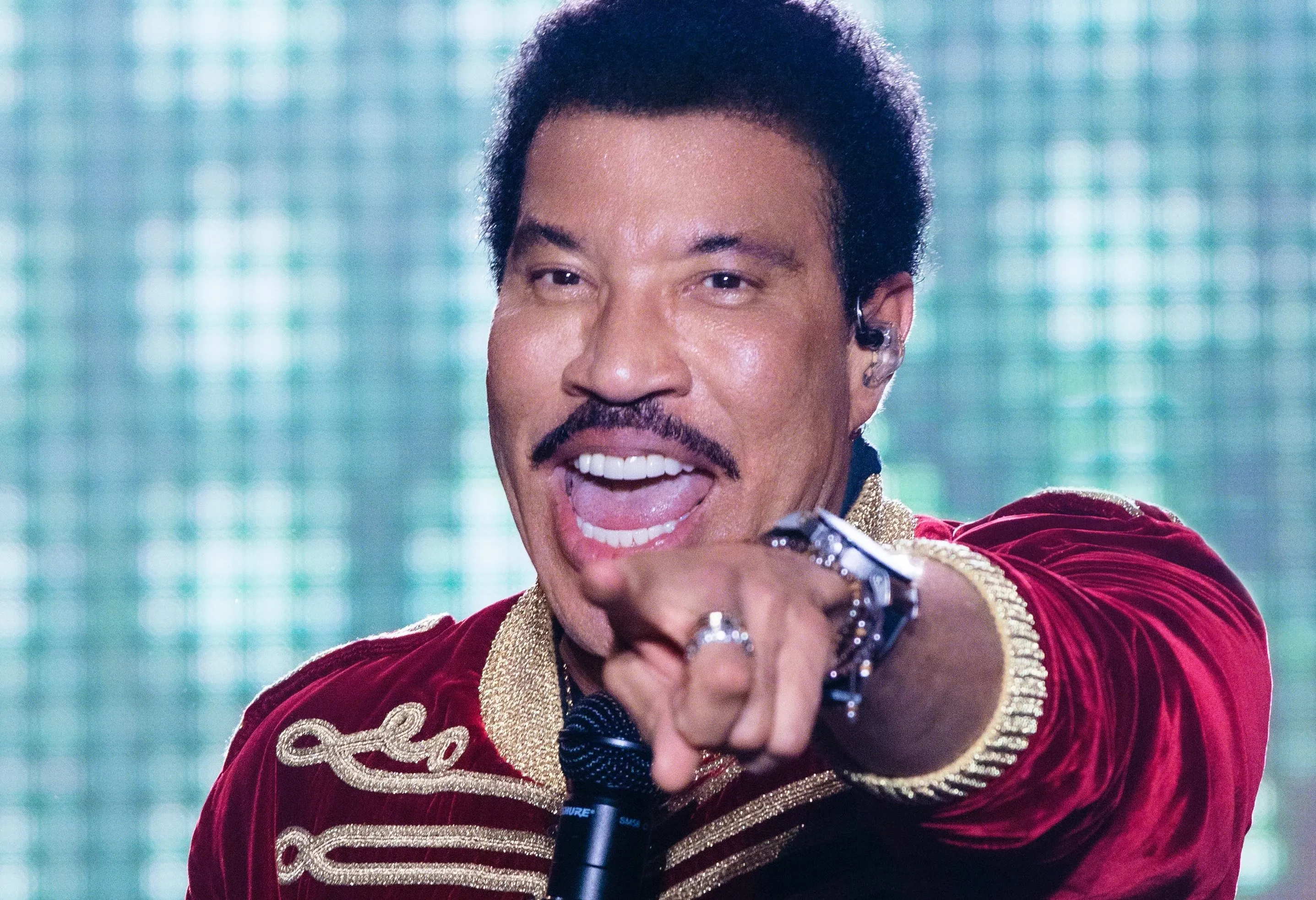 Lionel Richie performing on stage during a concert