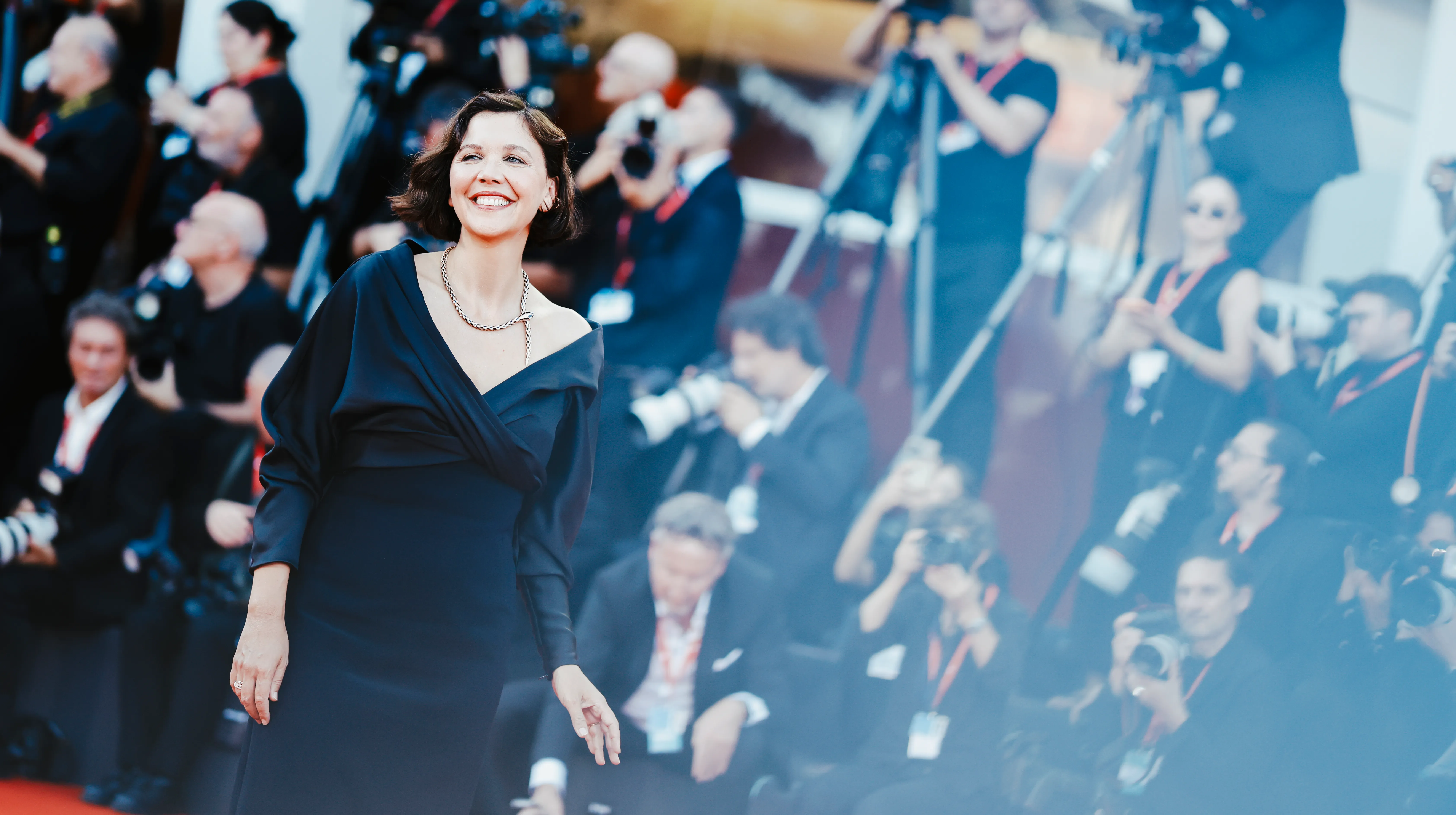 Maggie Gyllenhaal's Fashion Journey at the Venice Film Festival movies cover image