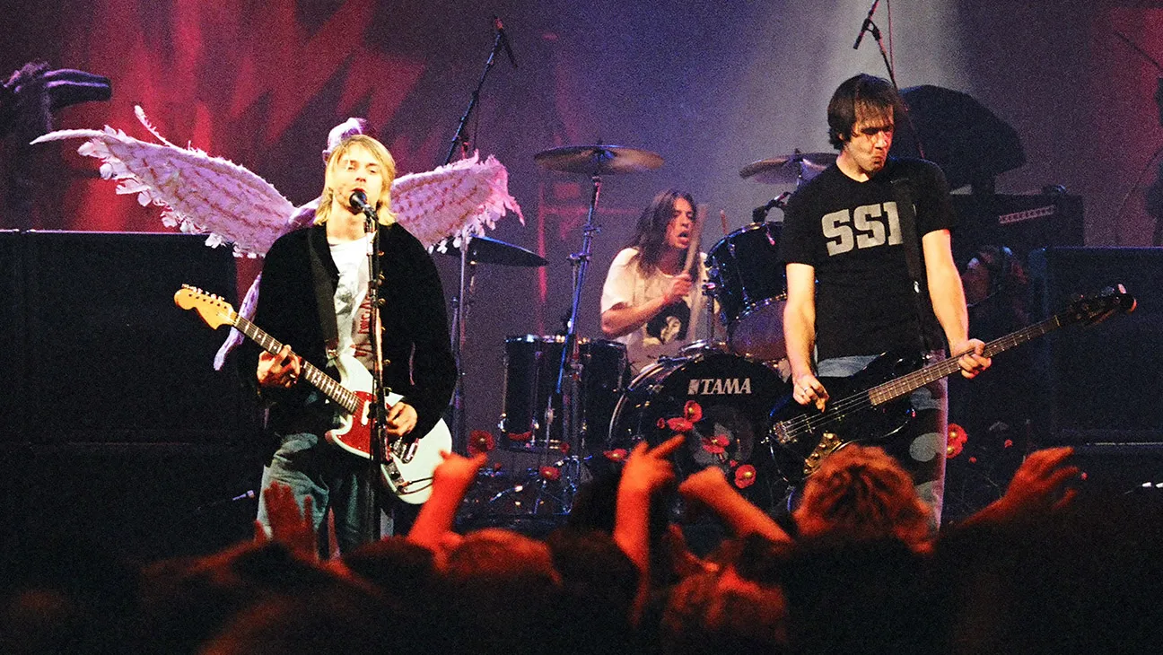 A photograph of Nirvana performing live