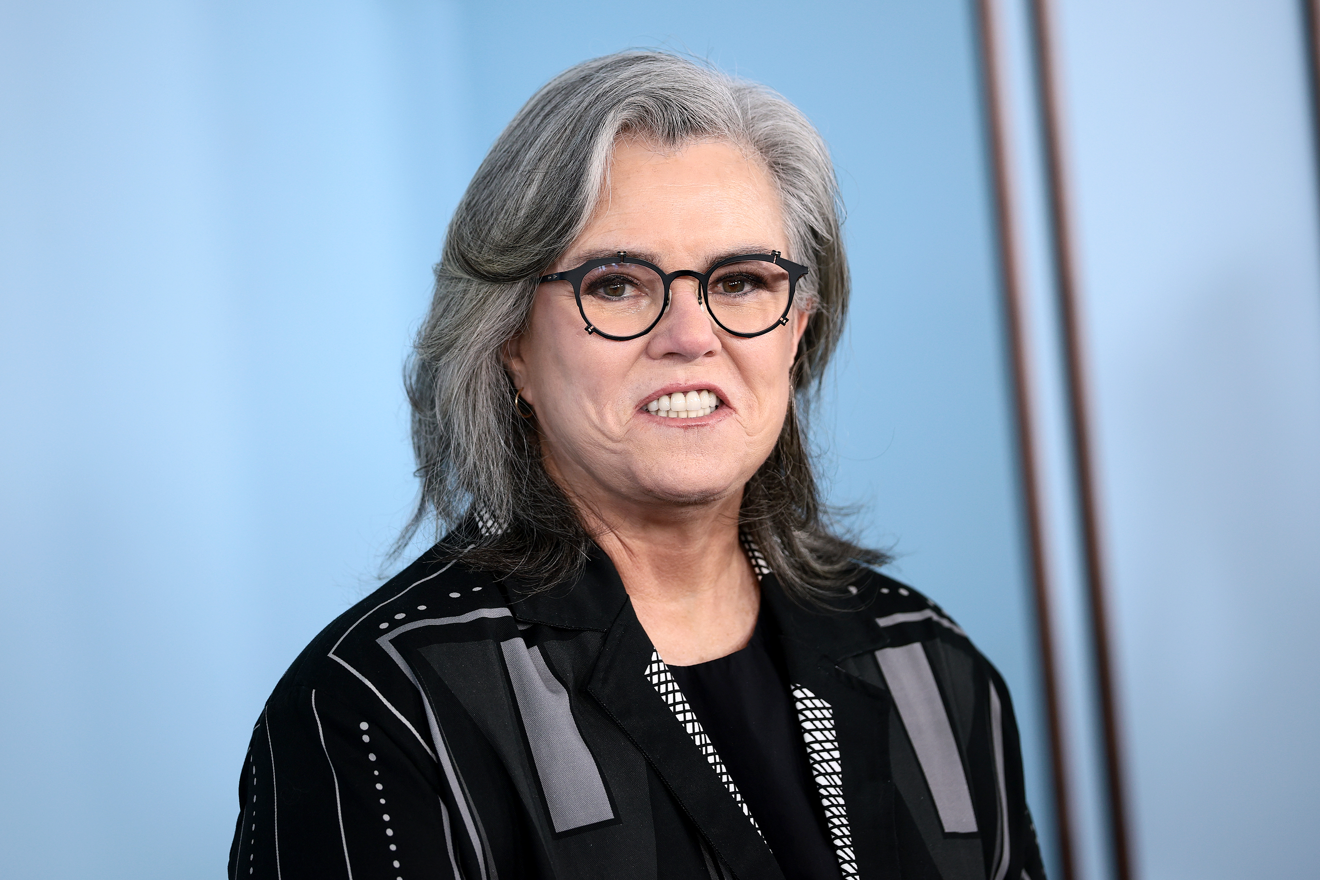 Rosie O'Donnell with Epstein Survivors during performance